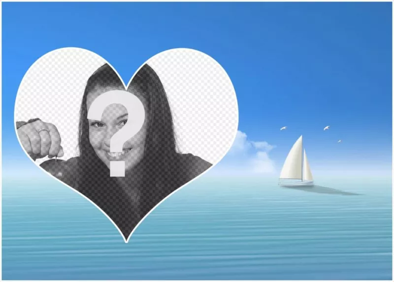 Fotomontaggio con un cuore nel mare e una barca a vela in background. ..